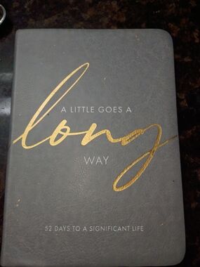 A Little Goes a Long Way - Gold Script on Gray motivational Book